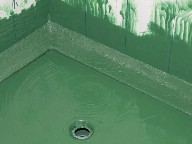 Shower floor coated with green waterproofing membrane before tiling
