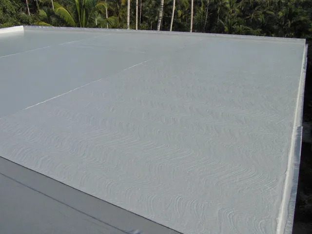 Flat villa roof coated with grey waterproofing membrane